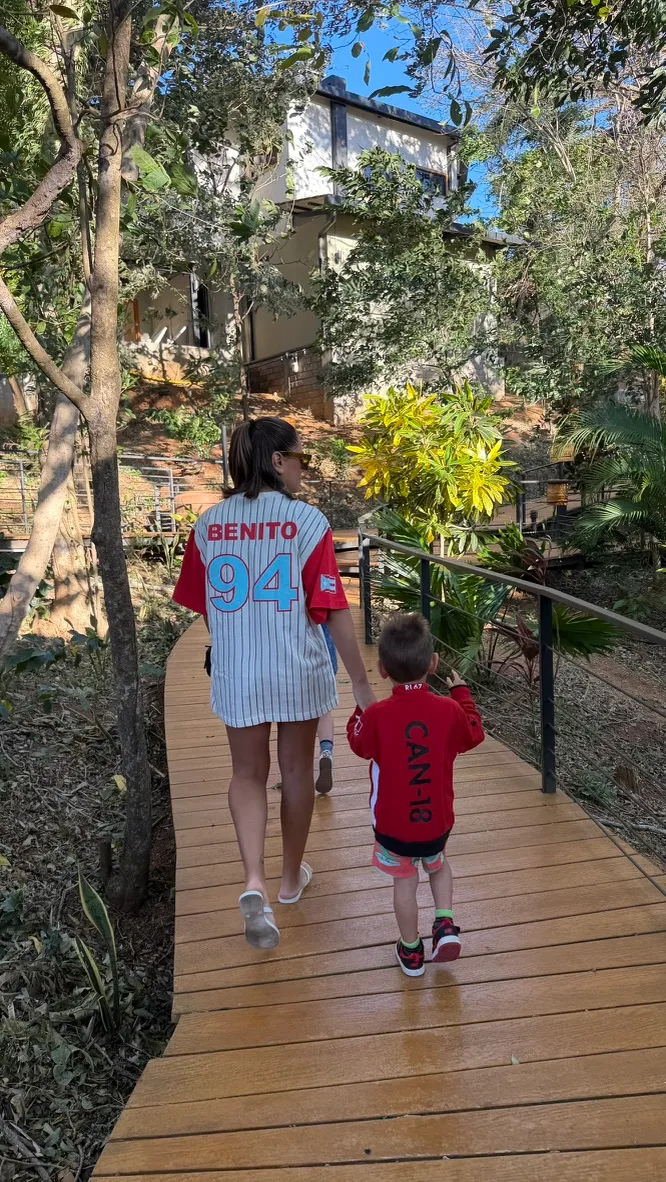 Walking the wooden pathways through the lush resort grounds