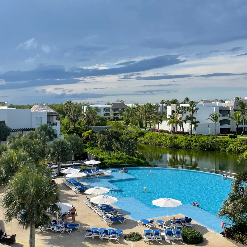Pool area with loungers overlooking the resort