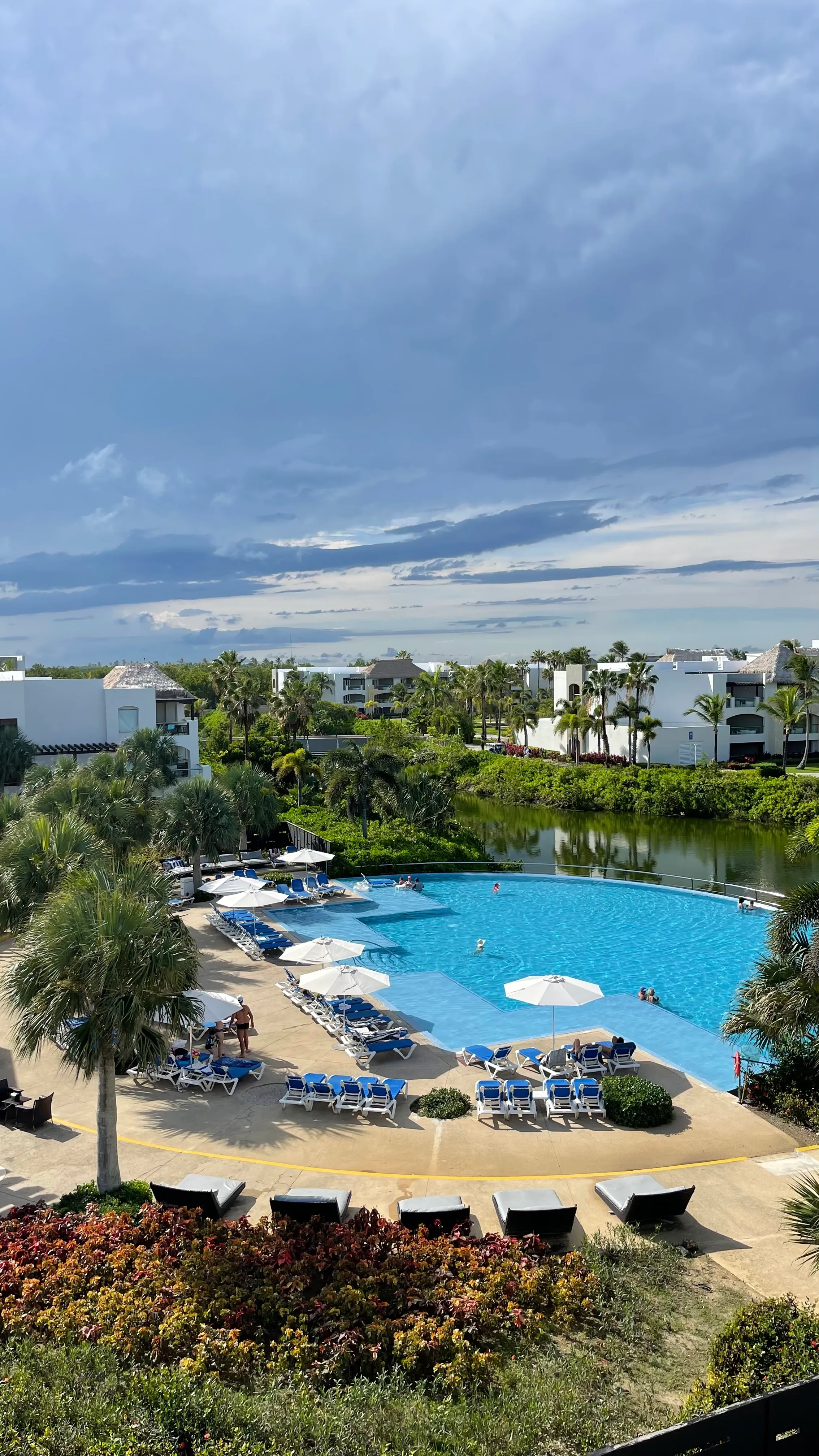 Pool area with loungers overlooking the resort