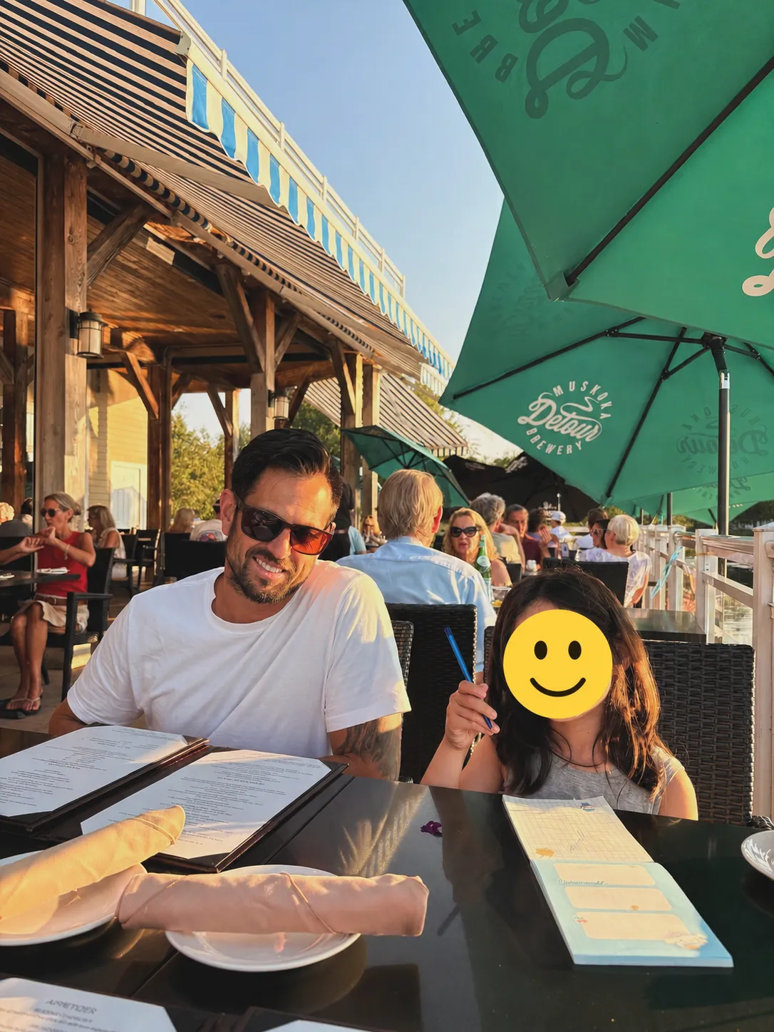 Family dinner at Dock of the Bay patio overlooking Lake Muskoka