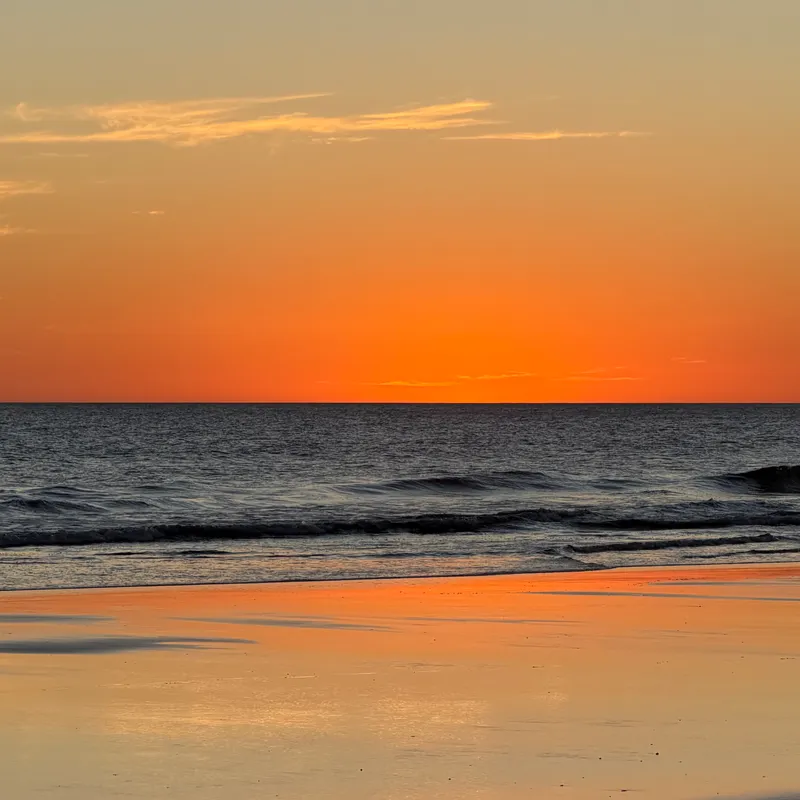 Stunning orange sunset over the Pacific Ocean in Tupilapa, Nicaragua