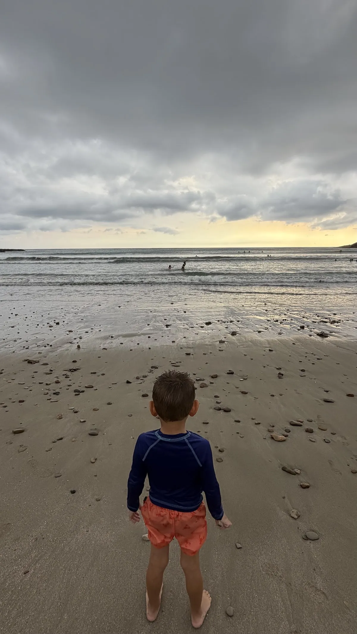 A child watching the waves at Playa El Remanso, Nicaragua